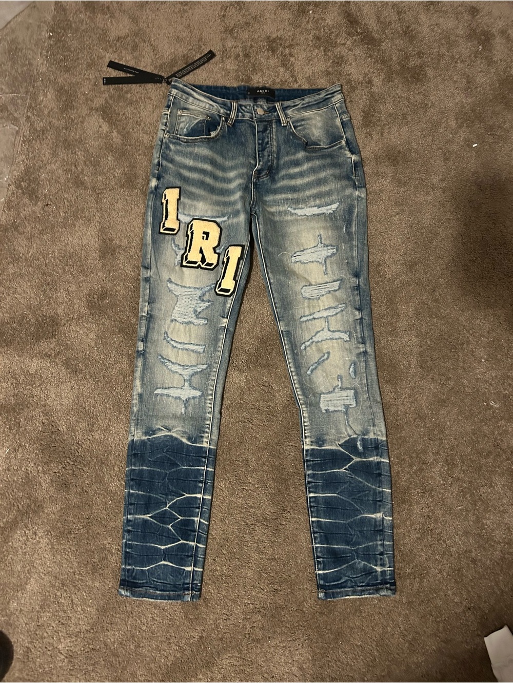 Amiri MA Varsity Patch Skinny Stacked Denim Jeans Light Wash Blue